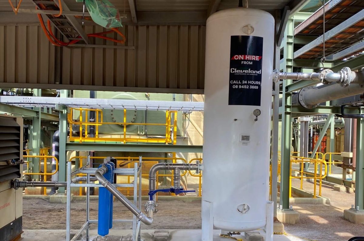 Cleveland Compressors air receiver tank on hire, installed with robust filtration and piping systems at an industrial facility, showcasing professional on-site setup.