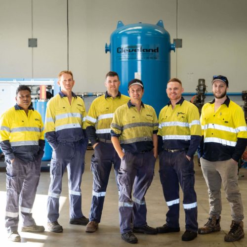 Technicians who carry out air compressor services.