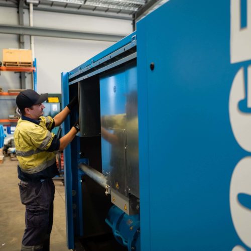 Technician fixing air compressor.